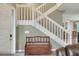 Entryway showcasing a staircase, neutral paint, tile flooring and a wooden bench at 3507 Autumn Glen Dr, Valrico, FL 33596