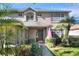 Inviting front exterior featuring lush landscaping, a well-maintained lawn, and a classic architectural design at 3507 Autumn Glen Dr, Valrico, FL 33596