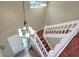 Bright and airy foyer with a modern chandelier, wooden staircase, and tiled floors at 3507 Autumn Glen Dr, Valrico, FL 33596