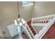 Bright foyer featuring a staircase, chandelier, bench and tile flooring at 3507 Autumn Glen Dr, Valrico, FL 33596