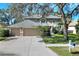 Charming two-story home featuring a three-car garage, mature trees and well-maintained landscaping at 3507 Autumn Glen Dr, Valrico, FL 33596
