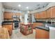 Gourmet kitchen with stainless steel appliances, granite countertops, and a center island at 3507 Autumn Glen Dr, Valrico, FL 33596