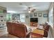 Spacious living room with tile flooring, comfortable seating, and a ceiling fan at 3507 Autumn Glen Dr, Valrico, FL 33596