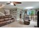 Living room with tile floor and an outdoor bar, plus stairway access at 3507 Autumn Glen Dr, Valrico, FL 33596