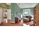 Spacious main bedroom features wood floors, sitting area, ensuite bathroom and large windows at 3507 Autumn Glen Dr, Valrico, FL 33596