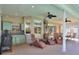 Spacious covered patio boasts an outdoor kitchen, lounge chairs, and dining area for entertaining at 3507 Autumn Glen Dr, Valrico, FL 33596