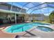 Beautiful backyard with a screened-in pool, spa, and covered patio, creating a relaxing retreat at 3507 Autumn Glen Dr, Valrico, FL 33596