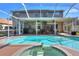 Backyard with screened-in pool and spa, perfect for relaxing and entertaining outdoors at 3507 Autumn Glen Dr, Valrico, FL 33596