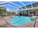 Gorgeous screened-in pool with a connected spa and plenty of patio seating at 3507 Autumn Glen Dr, Valrico, FL 33596