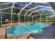 Beautiful screened-in pool with lush surroundings offering a private backyard oasis at 3507 Autumn Glen Dr, Valrico, FL 33596