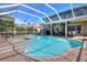 Inviting screened-in pool and spa with covered patio, perfect for outdoor gatherings and relaxation at 3507 Autumn Glen Dr, Valrico, FL 33596