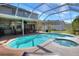 Stunning screened-in pool and spa with a covered patio for entertaining guests at 3507 Autumn Glen Dr, Valrico, FL 33596