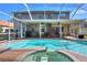 Beautiful backyard pool with hot tub and a covered patio at 3507 Autumn Glen Dr, Valrico, FL 33596