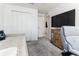 Bedroom featuring a bed, storage closet, and work desk, ideal for study and relaxation at 4035 Radiant Mountain Dr, Plant City, FL 33565