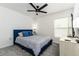 Comfortable bedroom features a plush bed, soft carpet, and plenty of natural light from a sunny window at 4035 Radiant Mountain Dr, Plant City, FL 33565