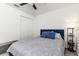 Inviting bedroom with a cozy bed, carpeted floor, a ceiling fan, and a side table with a lamp at 4035 Radiant Mountain Dr, Plant City, FL 33565
