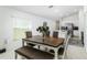 Bright dining area features a wood table, seating for six, and lots of natural light from the nearby window at 4035 Radiant Mountain Dr, Plant City, FL 33565