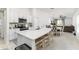 Open-concept kitchen with white countertops, stainless steel appliances and a view into the living area at 4035 Radiant Mountain Dr, Plant City, FL 33565