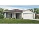 Charming single-story home featuring a well-manicured lawn and a two-car garage at 7019 161St E Ter, Parrish, FL 34219