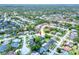 Aerial shot of a neighborhood with tree-lined streets and well-maintained homes at 8721 Latham Ln, Hudson, FL 34667