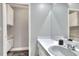 Secondary bathroom vanity with sink and storage cabinets located next to the toilet room at 8721 Latham Ln, Hudson, FL 34667