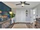 Bedroom with crib, area rug, and view of the closet and hallway leading to the kitchen at 8721 Latham Ln, Hudson, FL 34667