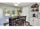 Bright eat-in kitchen with breakfast table and outdoor views at 8721 Latham Ln, Hudson, FL 34667