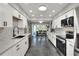 Spacious kitchen features stainless steel appliances, tiled backsplash and easy access to the dining area at 8721 Latham Ln, Hudson, FL 34667