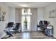 Home office with multiple desks, neutral colors, and natural light from windows at 8721 Latham Ln, Hudson, FL 34667