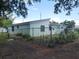 Fenced backyard offering privacy and space for outdoor activities and gardening at 1002 W La Salle St, Tampa, FL 33607