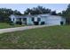 Charming single Gathering home with an attached garage and a well-maintained front yard at 1002 W La Salle St, Tampa, FL 33607