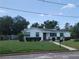 Inviting single-Gathering home with a well-kept lawn, complemented by mature trees, offering a serene setting at 1002 W La Salle St, Tampa, FL 33607
