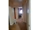 A hallway leads to various rooms, featuring neutral walls and carpeted flooring at 1002 W La Salle St, Tampa, FL 33607