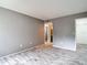 Bedroom with neutral gray walls, tile floors, and access to closet and bathroom at 11704 Raintree Village Blvd # B, Temple Terrace, FL 33617