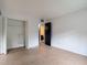 This bedroom has a closet for storage and ceramic floors at 11704 Raintree Village Blvd # B, Temple Terrace, FL 33617