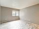 Bright bedroom featuring stylish wood-look floors and a window with natural light at 11704 Raintree Village Blvd # B, Temple Terrace, FL 33617