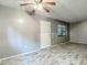 Spacious open floor plan with sleek flooring, neutral paint, and lots of natural light at 11704 Raintree Village Blvd # B, Temple Terrace, FL 33617