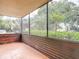 Screened-in patio with lovely plants at 11704 Raintree Village Blvd # B, Temple Terrace, FL 33617