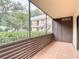 Screened-in patio with a view of the property's exterior at 11704 Raintree Village Blvd # B, Temple Terrace, FL 33617