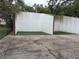 Outdoor racquetball court featuring white walls and green playing surface at 11704 Raintree Village Blvd # B, Temple Terrace, FL 33617