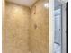 Tiled shower stall featuring a rainfall shower head, adding a touch of luxury to the bathroom at 11704 Raintree Village Blvd # B, Temple Terrace, FL 33617