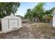 Spacious backyard with a storage shed, mature trees and room for outdoor activities at 1317 E Laura St, Plant City, FL 33563