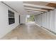 Attached covered carport area, providing ample parking and shelter with privacy curtains at 1317 E Laura St, Plant City, FL 33563