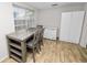 Bright dining area with tile floors, modern furniture, and a large storage cabinet at 1317 E Laura St, Plant City, FL 33563