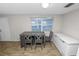 Cozy dining area with a table, four chairs, tile flooring, and a view of the exterior at 1317 E Laura St, Plant City, FL 33563