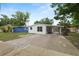 Inviting single-story home with a carport and a fresh white painted brick exterior at 1317 E Laura St, Plant City, FL 33563