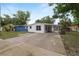 Charming single-story home with a covered carport and freshly painted white exterior at 1317 E Laura St, Plant City, FL 33563