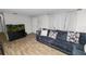 Relaxing living room with a comfy couch, stylish decor, and ample natural light at 1317 E Laura St, Plant City, FL 33563