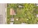 Expansive backyard with lush green lawn, mature trees and a white privacy fence at 1603 N Park Rd, Plant City, FL 33563