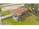 Aerial view of a well-maintained single Gathering home, showcasing the spacious yard and proximity to the road at 1603 N Park Rd, Plant City, FL 33563